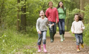 family on walk in the woods