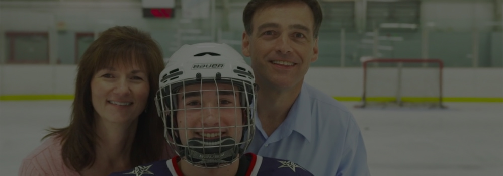 Hockey Player With Family Smiling